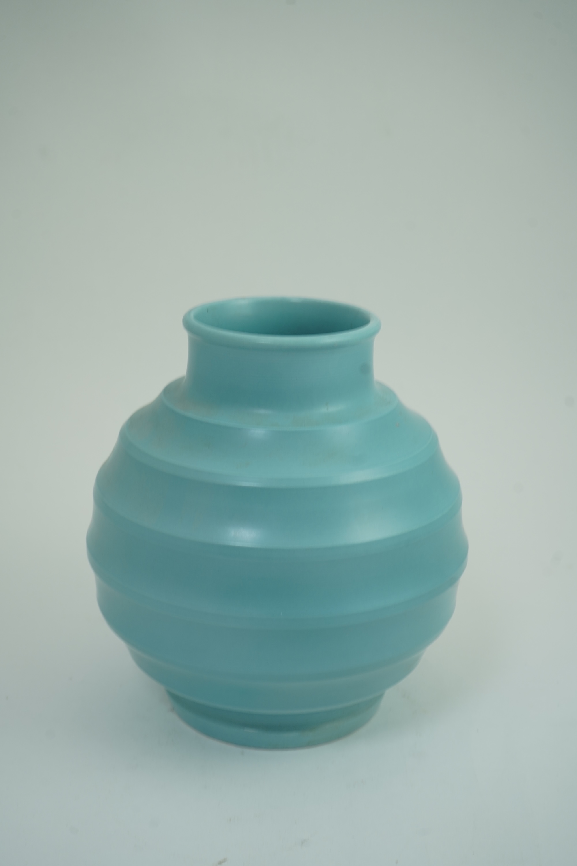 Keith Murray MC RDI FRIBA (New Zealand/British, 1892-1981) for Wedgwood: A matt blue glazed globe vase
